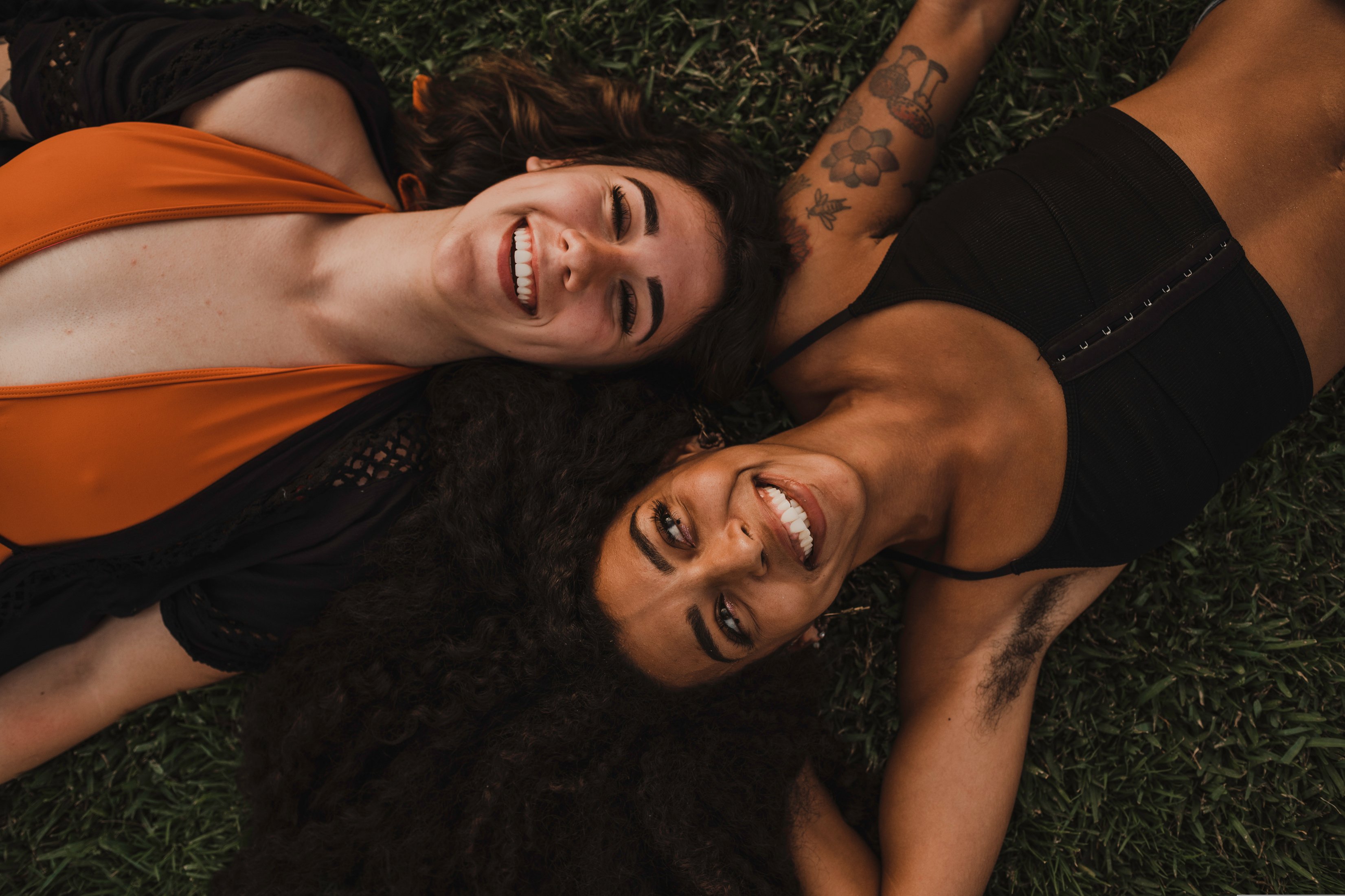 Women Laying on Grass